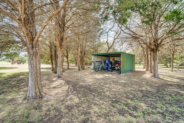 view of yard with an outbuilding and a pole building