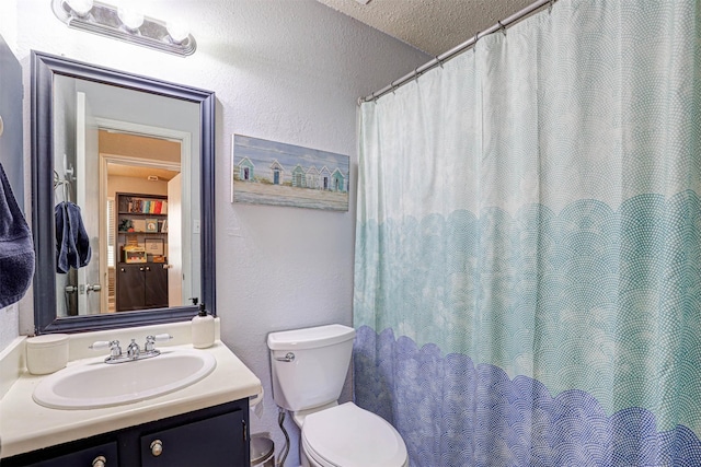 full bathroom featuring vanity, visible vents, a textured ceiling, toilet, and a textured wall