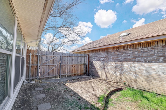 view of yard with a gate and fence