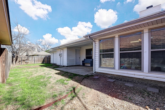 view of yard with a fenced backyard and a patio area