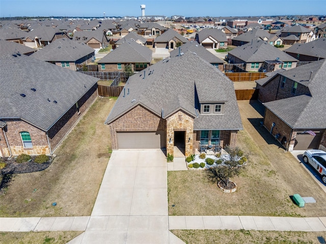 birds eye view of property with a residential view