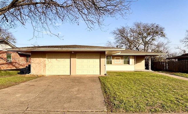 ranch-style home with stucco siding, fence, concrete driveway, an attached garage, and a front yard