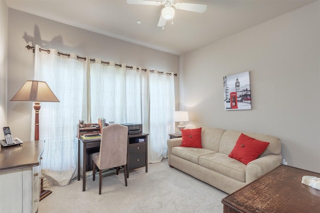 office space featuring light colored carpet and ceiling fan