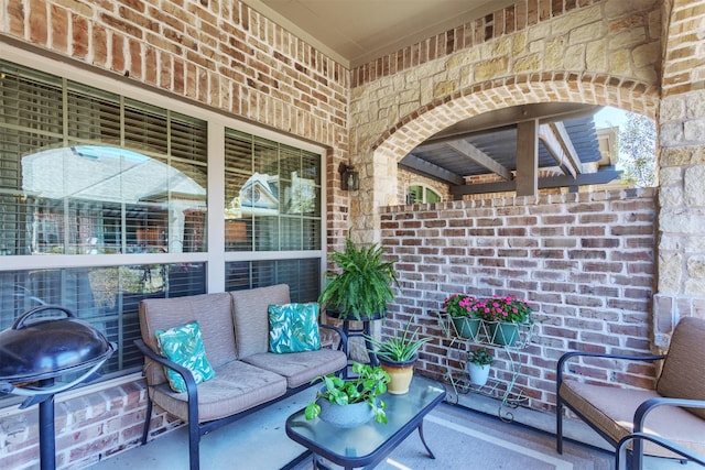 view of patio / terrace with an outdoor living space and area for grilling