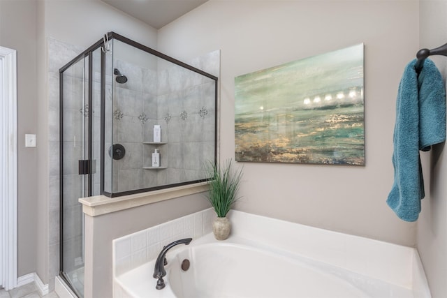 bathroom with a garden tub and a shower stall