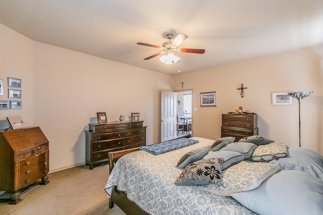 bedroom featuring light carpet and ceiling fan