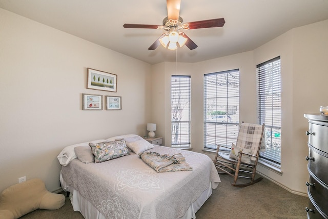 carpeted bedroom with a ceiling fan