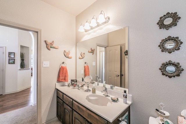 bathroom featuring vanity and wood finished floors