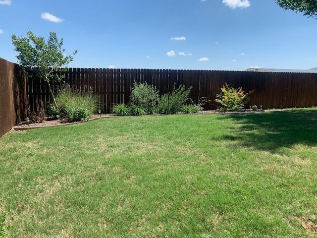 1013 Vista View Dr, Burleson, TX 76028 - view of yard with a fenced backyard
