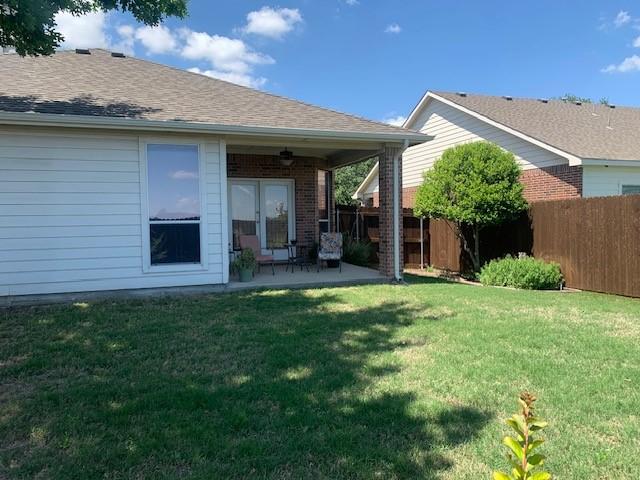 1013 Vista View Dr, Burleson, TX 76028 - rear view of house with fence, a lawn, a patio area, and brick siding