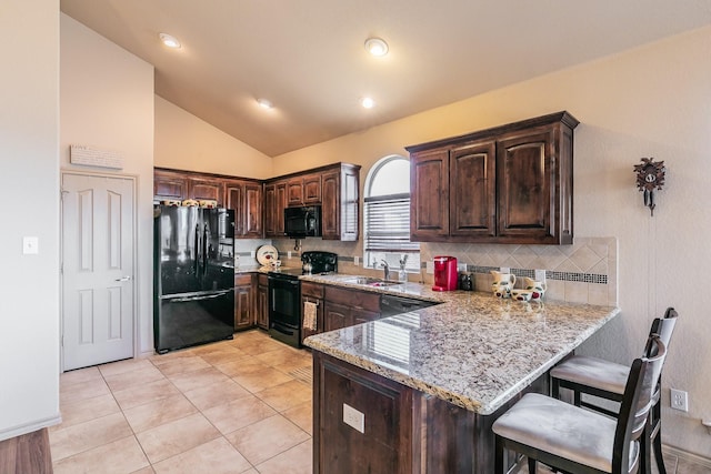 1013 Vista View Dr, Burleson, TX 76028 - kitchen with dark brown cabinets, decorative backsplash, black appliances, and a peninsula