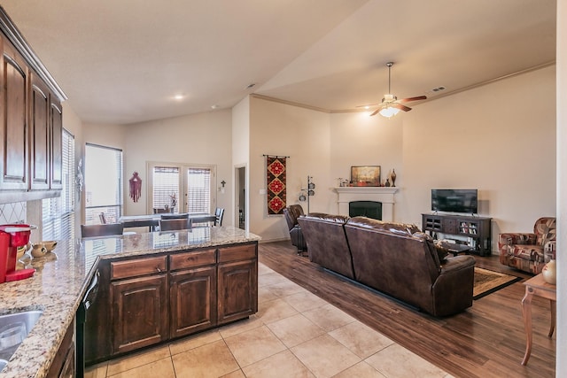 1013 Vista View Dr, Burleson, TX 76028 - living area with ornamental molding, a fireplace, light wood-style floors, high vaulted ceiling, and a ceiling fan