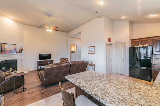 1013 Vista View Dr, Burleson, TX 76028 - kitchen with freestanding refrigerator, a ceiling fan, open floor plan, and light stone countertops
