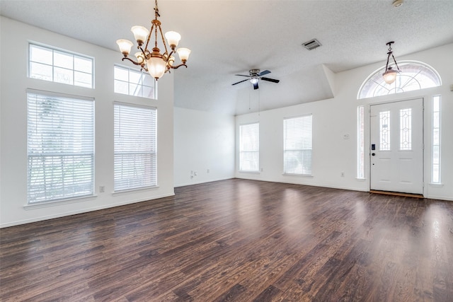 entryway with a wealth of natural light, visible vents, and dark wood-type flooring