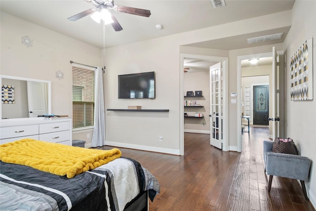 bedroom with visible vents, baseboards, and wood-type flooring