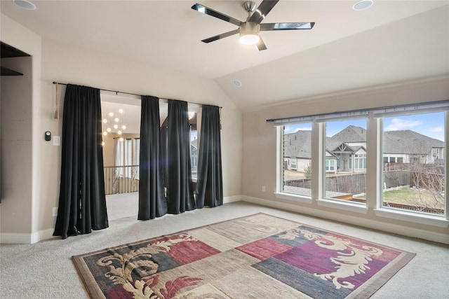 carpeted bedroom with ceiling fan, baseboards, and vaulted ceiling