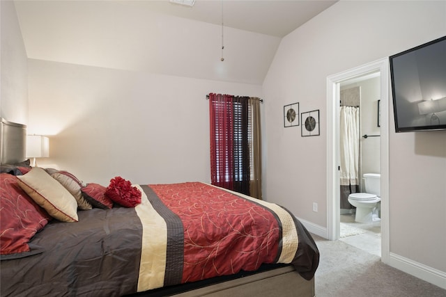 bedroom featuring visible vents, connected bathroom, baseboards, lofted ceiling, and carpet flooring