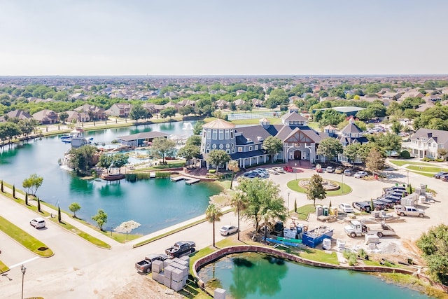 drone / aerial view featuring a residential view and a water view