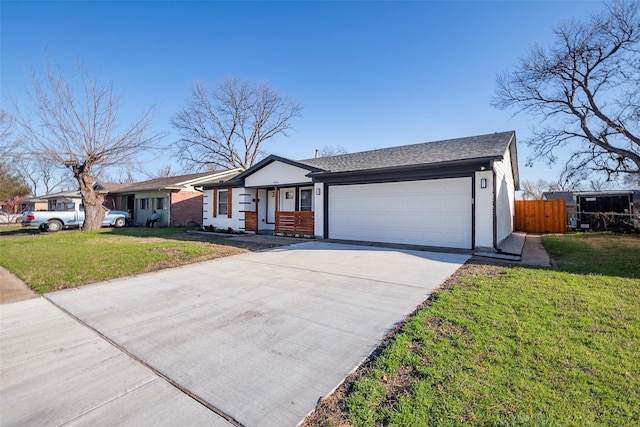 ranch-style house featuring a front yard, concrete driveway, fence, and a garage