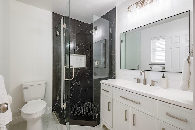 bathroom with vanity, toilet, and a marble finish shower