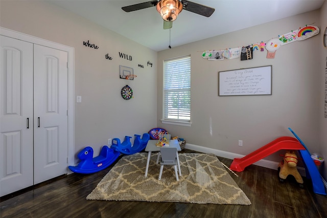 game room featuring a ceiling fan, baseboards, and wood finished floors