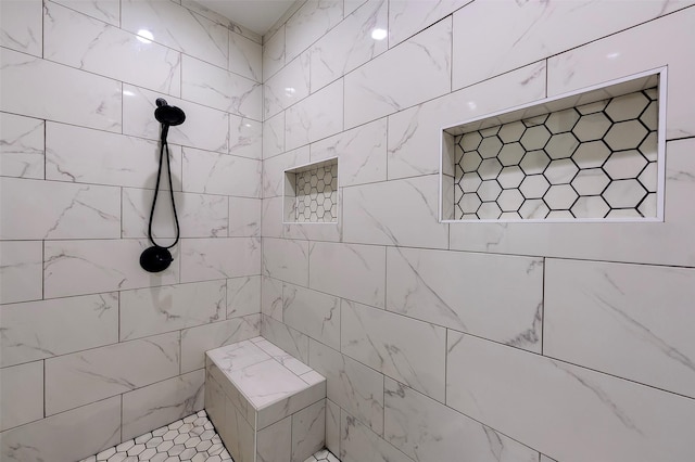 full bathroom featuring a tile shower