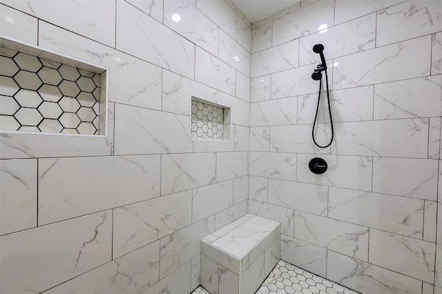 bathroom featuring tiled shower