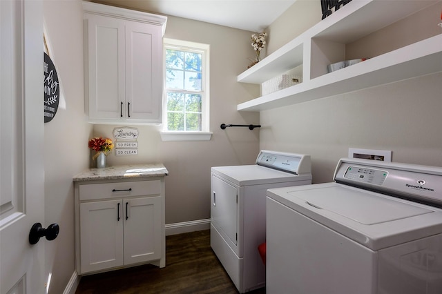 washroom with cabinet space, dark wood-type flooring, baseboards, and separate washer and dryer