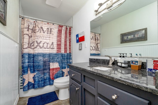 full bath featuring vanity, shower / tub combo, and toilet