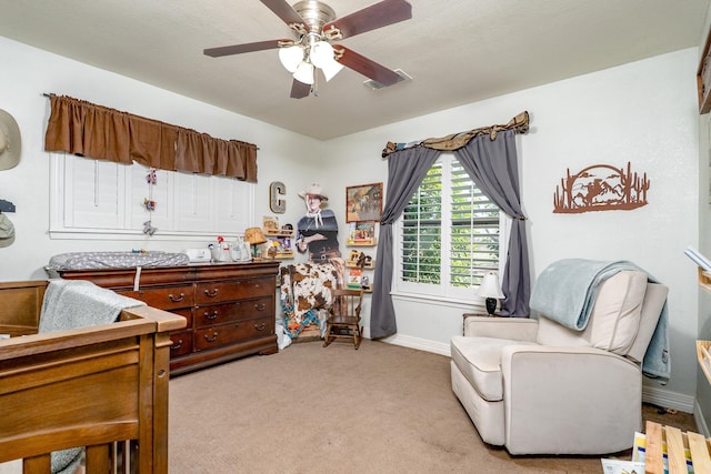 bedroom with light carpet, visible vents, ceiling fan, and baseboards