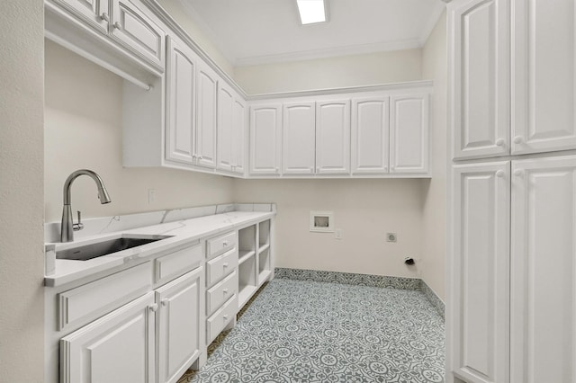 washroom with crown molding, washer hookup, cabinet space, hookup for an electric dryer, and a sink