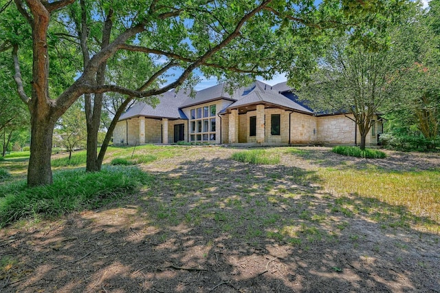 view of front of house with stone siding