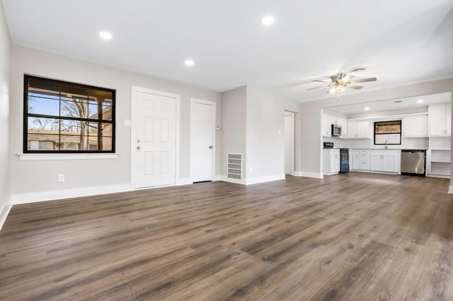 unfurnished living room featuring visible vents, recessed lighting, baseboards, and dark wood-style flooring