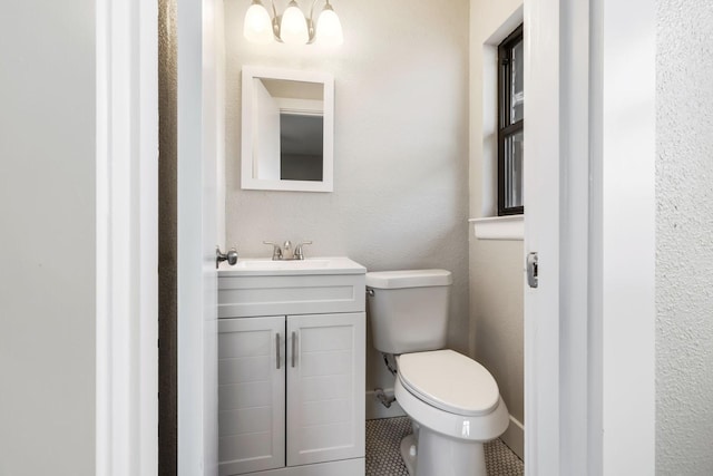half bath with toilet and vanity