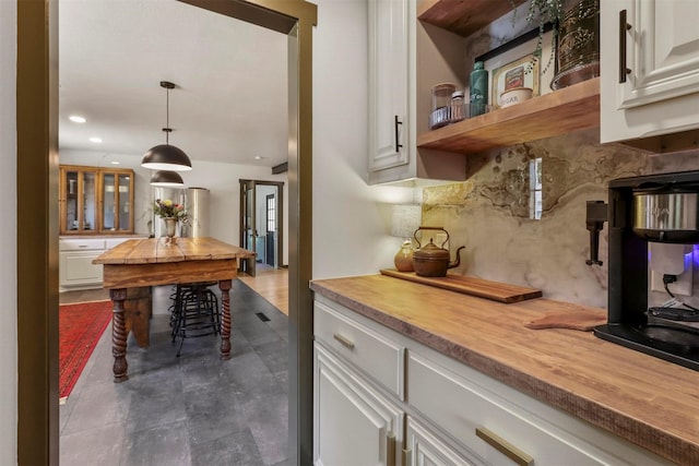 bar featuring decorative light fixtures, decorative backsplash, and recessed lighting