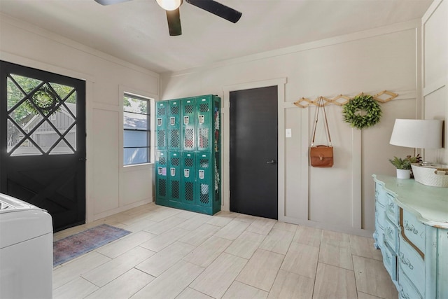 foyer entrance featuring washer / clothes dryer and a ceiling fan