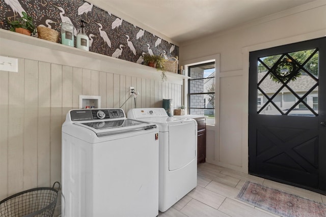 clothes washing area featuring laundry area and washing machine and dryer