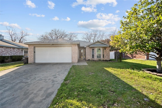 single story home featuring a front lawn, an attached garage, brick siding, and driveway