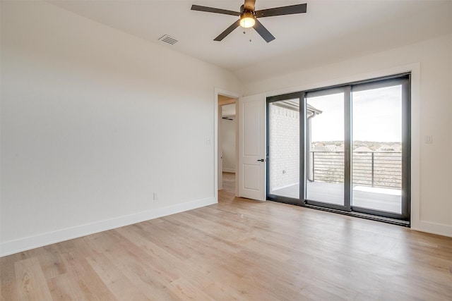 empty room with light wood finished floors, visible vents, a ceiling fan, and baseboards