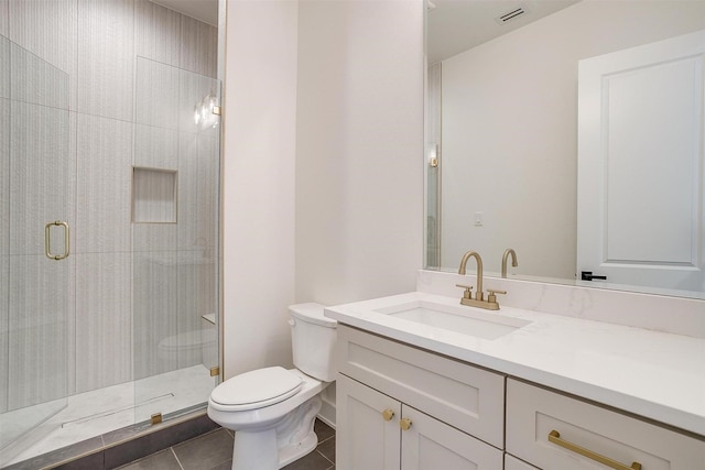 full bathroom featuring visible vents, toilet, tile patterned flooring, tiled shower, and vanity