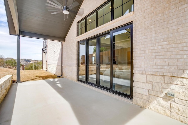 view of patio featuring a ceiling fan