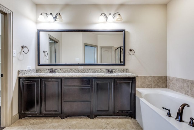 bathroom featuring a sink, a garden tub, double vanity, and tile patterned flooring