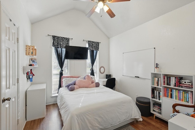 bedroom featuring a ceiling fan, lofted ceiling, and wood finished floors