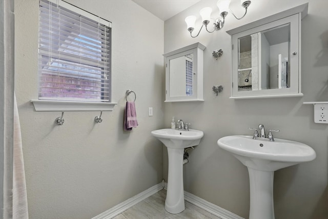 full bathroom featuring a sink and baseboards