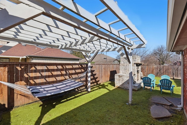 view of yard featuring a pergola and a fenced backyard