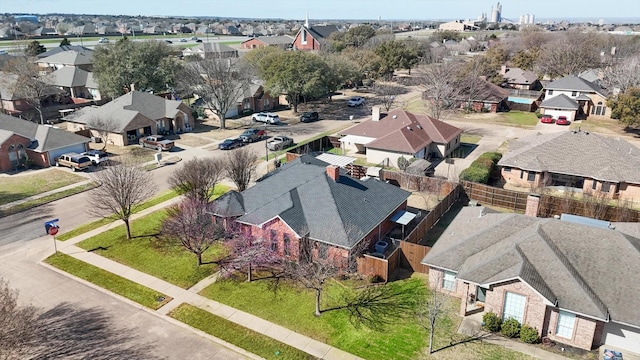 birds eye view of property with a residential view