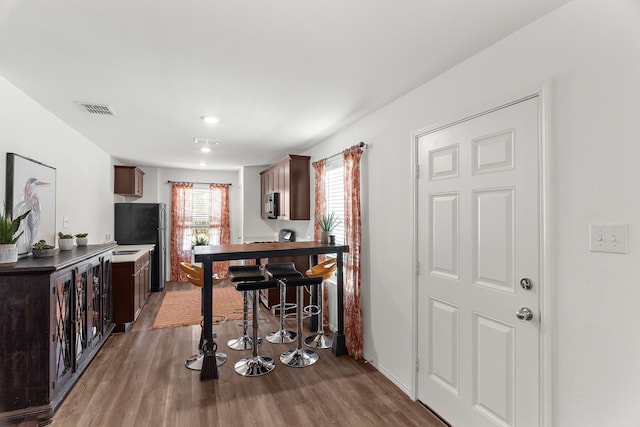 interior space featuring wood finished floors and visible vents