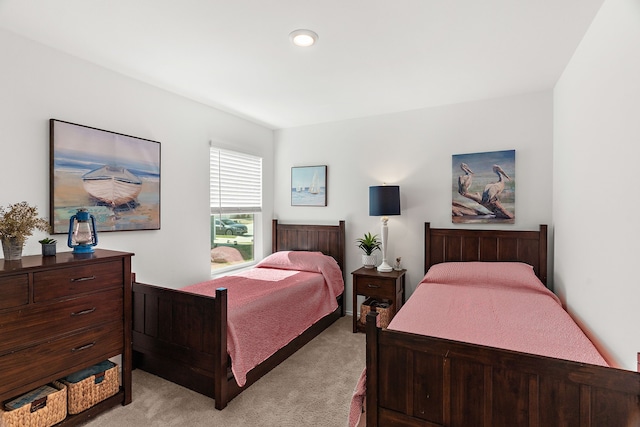 bedroom featuring light carpet