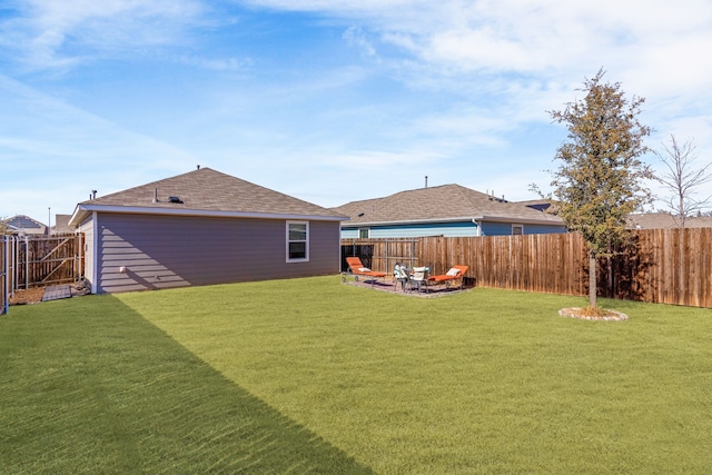 view of yard with a patio area and a fenced backyard