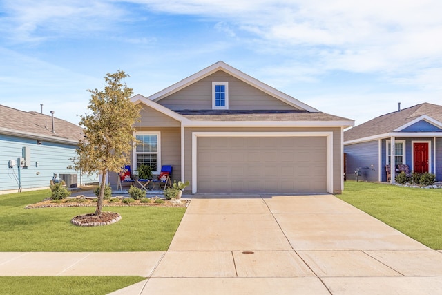 view of front of home with cooling unit, driveway, an attached garage, and a front lawn